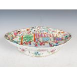 A Chinese porcelain famille rose Canton lozenge shaped footed dish, Qing Dynasty, decorated with