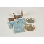 Cartier, a set of four Sterling silver vesta holders and a pair of Sterling silver circular