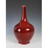 A Chinese porcelain sang de boeuf glazed bottle vase, late 19th/early 20th century, 37.5cm high.