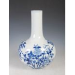 A Chinese porcelain blue and white bottle vase, late 19th/ early 20th century, decorated with peony,