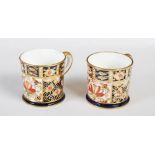Two miniature Royal Crown Derby coffee cans, one dated 1907, decorated in the Imari palette, printed