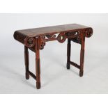 A Chinese dark wood rectangular table, late Qing Dynasty, the rectangular panelled top above a