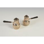A pair of Edwardian silver chocolate pots, London, 1907, makers mark of 'h.c.', with part