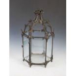 A 19th century gilt metal mounted hexagonal shaped hanging lantern, with scroll and foliate cast