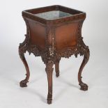 A George III style mahogany jardiniere stand in the Chinese Chippendale taste, the square section