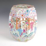 A Chinese porcelain famille rose barrel shaped garden seat, Qing Dynasty, the octagonal shaped top