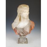 A late 19th century marble and pink alabaster bust of a Classical maiden, on mottled black and white