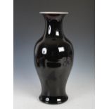 A Chinese porcelain famille noir monochrome glazed vase, Qing Dynasty, 44cm high.
