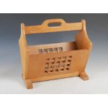 Leafman - a carved oak newspaper stand, the rectangular sides with pierced and interlaced carved