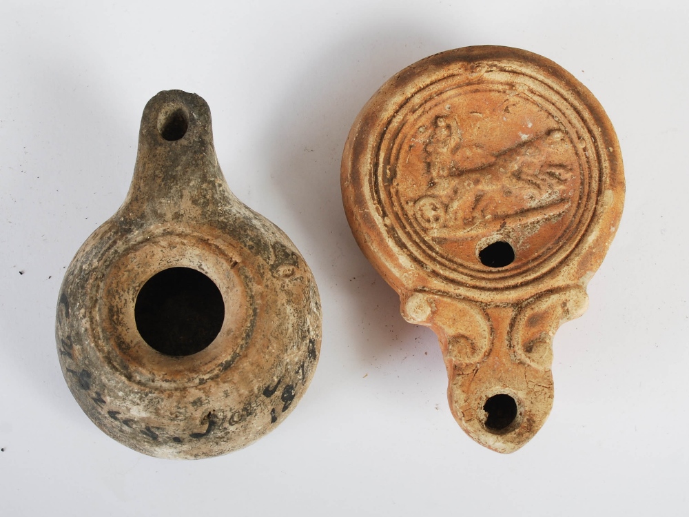 Antiquities- A collection of eight Ancient Roman terracotta oil lamps, comprising; one plain oil - Image 9 of 20