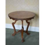 A 19th century Continental rosewood, mahogany and boxwood lined circular occasional table, the