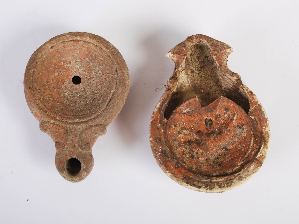 Antiquities- A collection of eight Ancient Roman terracotta oil lamps, comprising; one plain oil - Image 3 of 20