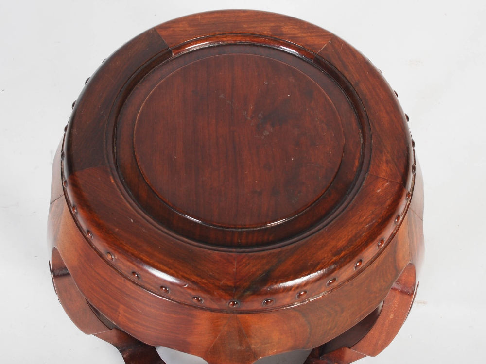 A Chinese dark wood barrel shaped stool, 20th century, the circular panelled top within a studded - Image 2 of 6