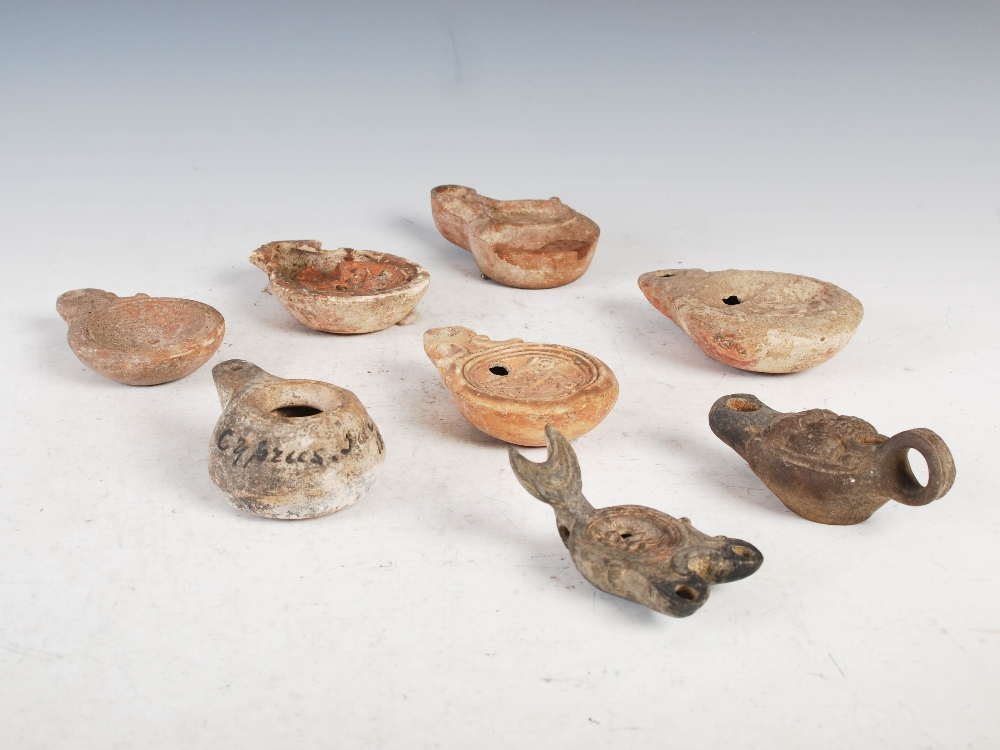 Antiquities- A collection of eight Ancient Roman terracotta oil lamps, comprising; one plain oil - Image 2 of 20