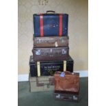 A collection of assorted vintage luggage, to include a green canvas and brown leather bound metal