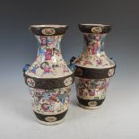 A pair of Chinese porcelain famille rose crackle glazed vases, Qing Dynasty, decorated with scenes