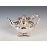A Victorian silver teapot, London, 1840, makers mark of IW, of lobbed circular form with engraved