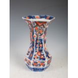 A late 19th century Japanese Imari porcelain hexagonal shaped vase, decorated with panels of flowers