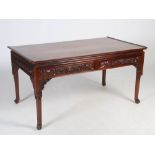 A Chinese dark wood writing desk, late 19th/early 20th century, the panelled rectangular top with