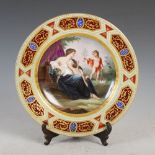 A Vienna porcelain cabinet plate, decorated with Classical scene of male figure reclining in a chair