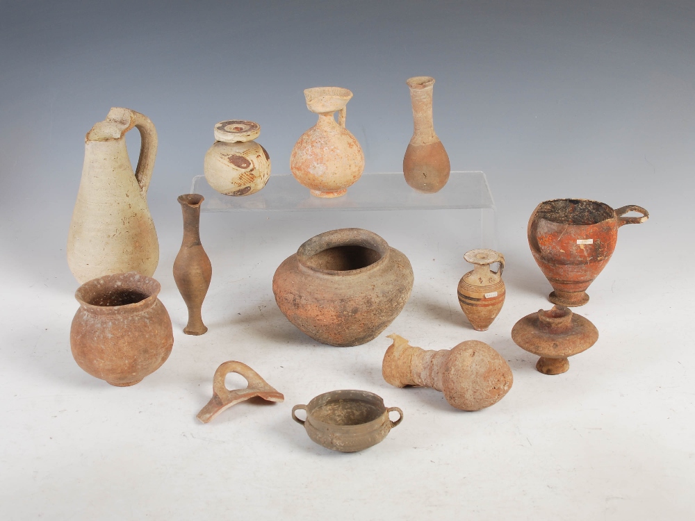 Antiquities- A collection of Ancient Roman pottery, comprising; small aryballos with oviform body