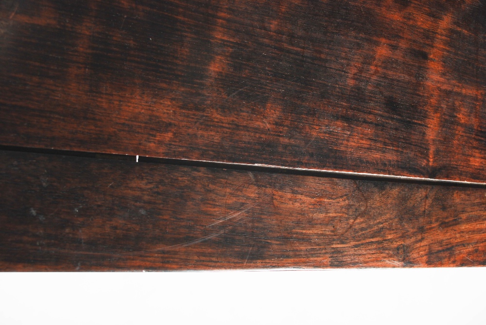 A Chinese dark wood rectangular table, Qing Dynasty, the rectangular panelled top above a plain - Image 8 of 8