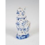 An 18th/ 19th century blue and white delft pottery model of a seated cat, blue painted mark, 12cm