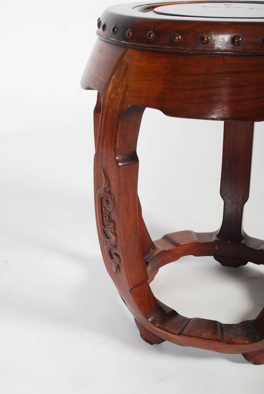 A Chinese dark wood barrel shaped stool, 20th century, the circular panelled top within a studded - Image 3 of 6