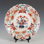 A late 19th/early 20th century Japanese Imari porcelain dish, decorated with central roundel of