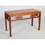 A Chinese rectangular table, 20th century, the rectangular panelled top above an open frieze set