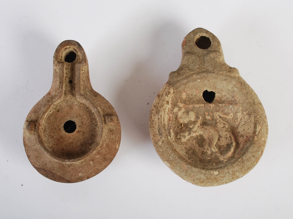 Antiquities- A collection of eight Ancient Roman terracotta oil lamps, comprising; one plain oil - Image 6 of 20