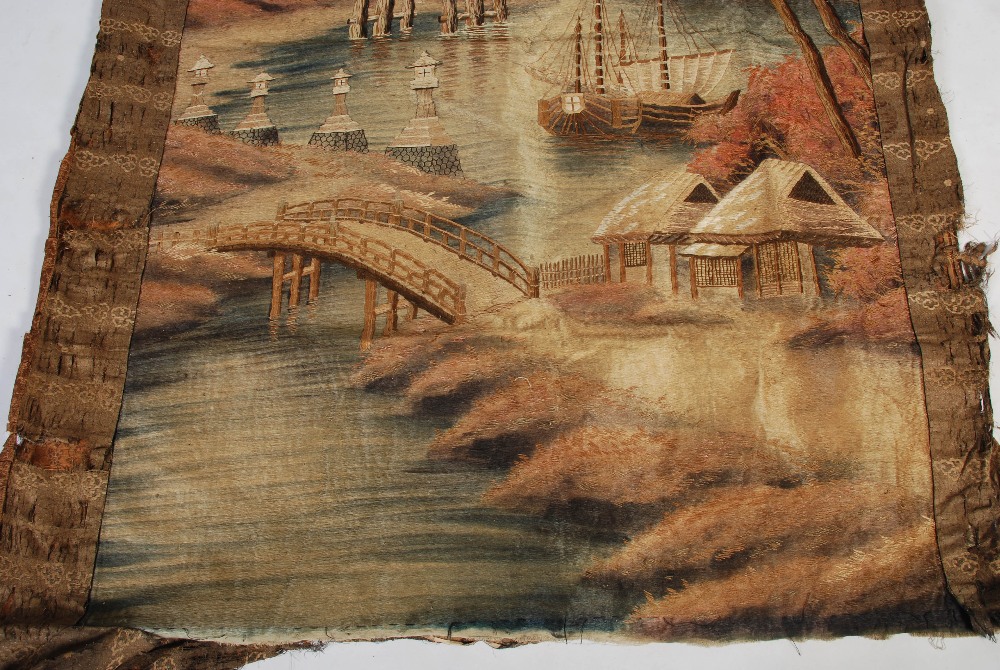 A Japanese silkwork hanging, Meiji Period, worked in coloured threads with river scene, bridge, - Image 3 of 8
