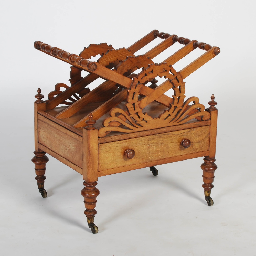 A 19th century mahogany Canterbury, the rectangular top with three divisions and pierced laurel