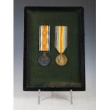 A framed pair of Great War medals, inscribed to '14595 PTE T MC NAIR S.GDS', 27cm x 19.5cm.