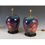 Finches, a pair of modern Moorcroft pottery table lamps and shades, mounted on circular mahogany