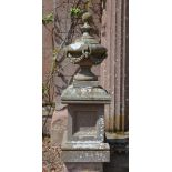 ***WITHDRAWN*** An impressive pair of 19th century stone urns on plinths, formed in three sections,