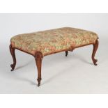 A Victorian rosewood centre stool, the later fruit and foliate upholstered top raised on four scroll