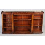 A Victorian walnut breakfront open bookcase, the shaped rectangular top with pierced gilt metal