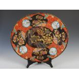 A Japanese Imari porcelain oval shaped meat plate, late 19th/early 20th century, with later