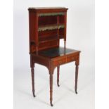 A Victorian mahogany and gilt metal mounted writing table, the upright back with rectangular top and