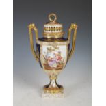 A late 19th century Dresden porcelain cobalt blue ground porcelain twin handled urn and cover,