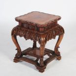 A Japanese carved wood urn stand, late 19th/early 20th century, the square shaped top with Greek key