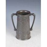 A Tudric pewter twin handled loving cup designed by Archibald Knox for Liberty & Co., inscribed with