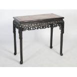 A Chinese dark wood rectangular table, Qing Dynasty, the rectangular top with a mottled red and