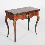 A 19th century ebonised and gilt metal mounted boulle work card table, the hinged revolving