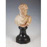 Antiquities- An antique Roman marble bust of a bearded male, mounted on weighted ebonised socle