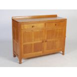 Mouseman - a carved oak sideboard, the adzed rectangular top above two frieze drawers and pair of
