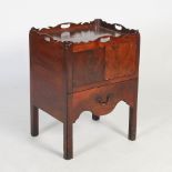 A George III mahogany tray top commode, the rectangular top with shaped gallery and four cut out