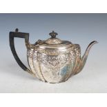 A Victorian silver teapot, London, 1895, makers mark of GMJ, oval shaped, with embossed border of