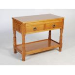 Knightman - An oak side table, the rectangular top above two frieze drawers, raised on four shaped